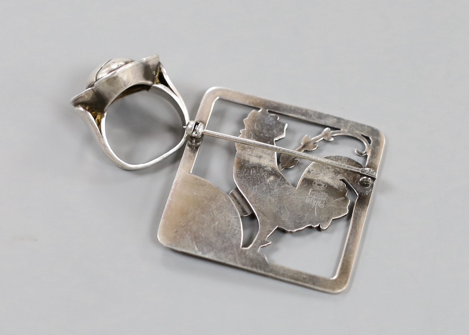 A Georg Jensen sterling square cockerel brooch and frond, no. 276, 37mm and a Jensen style flower head ring, size G.